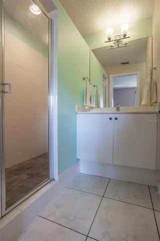 an aerial view of a city with ocean view