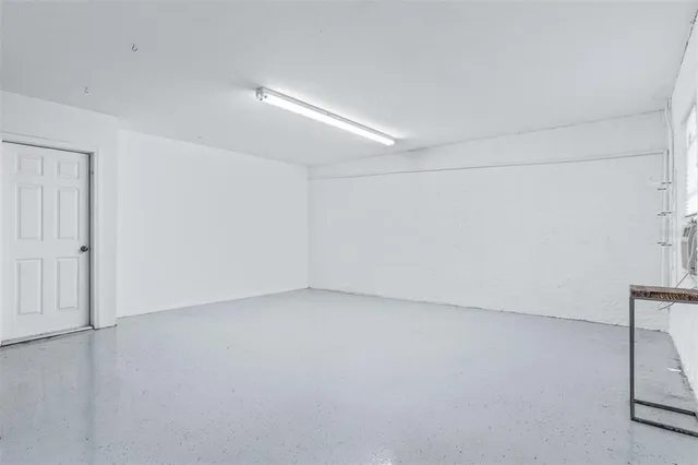 a living room with furniture and a ceiling fan