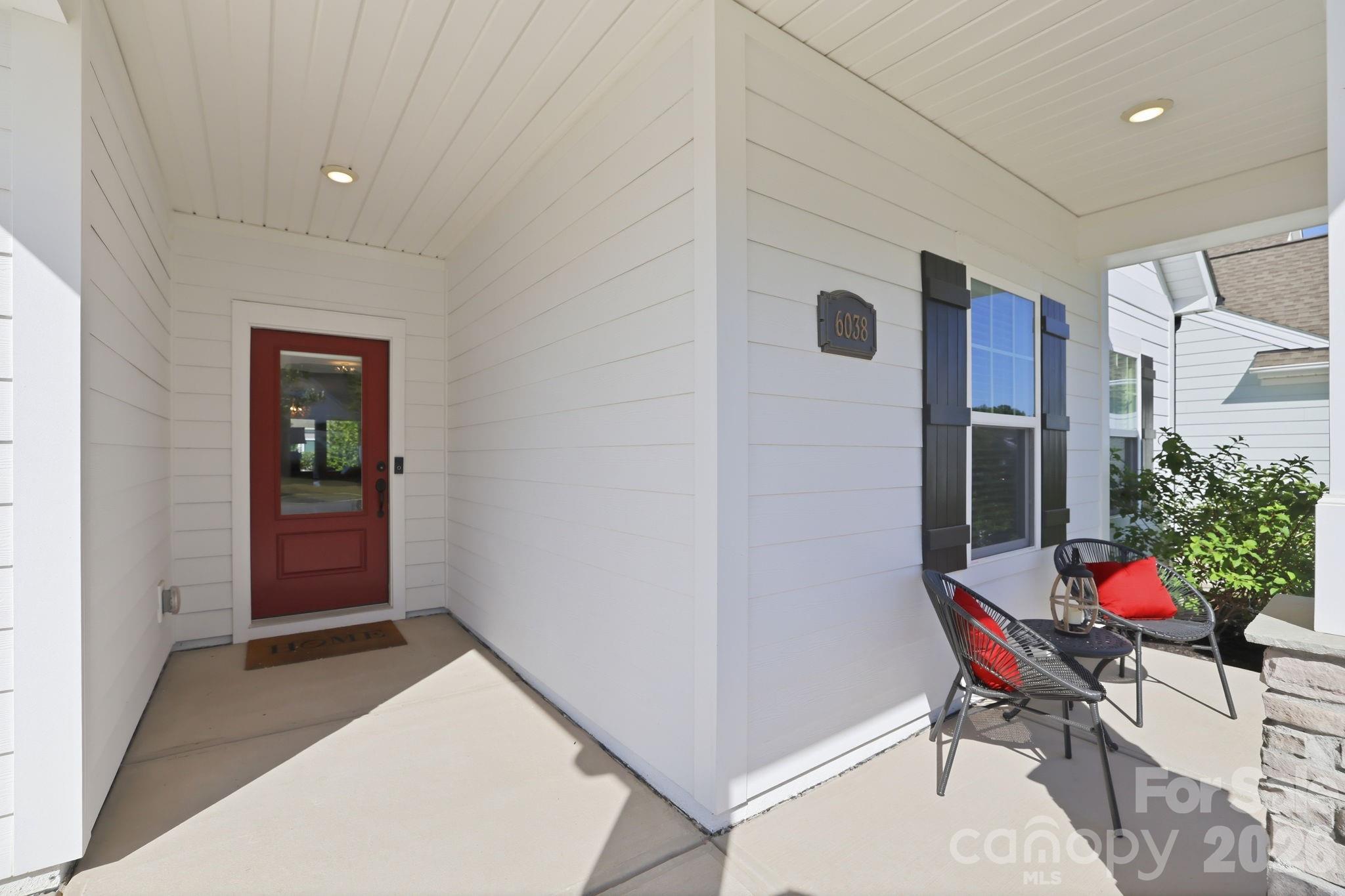 6038 Holland Street Fort Mill, SC 29707 - Photo 33 of 48 a balcony with furniture and flowers