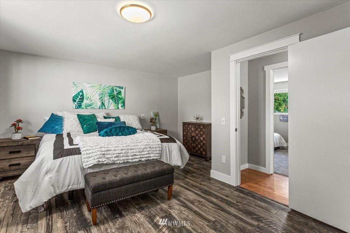 17320 Southeast 135th Street Renton, WA 98059 - Photo 17 of 28 a bedroom with furniture and a wooden floor