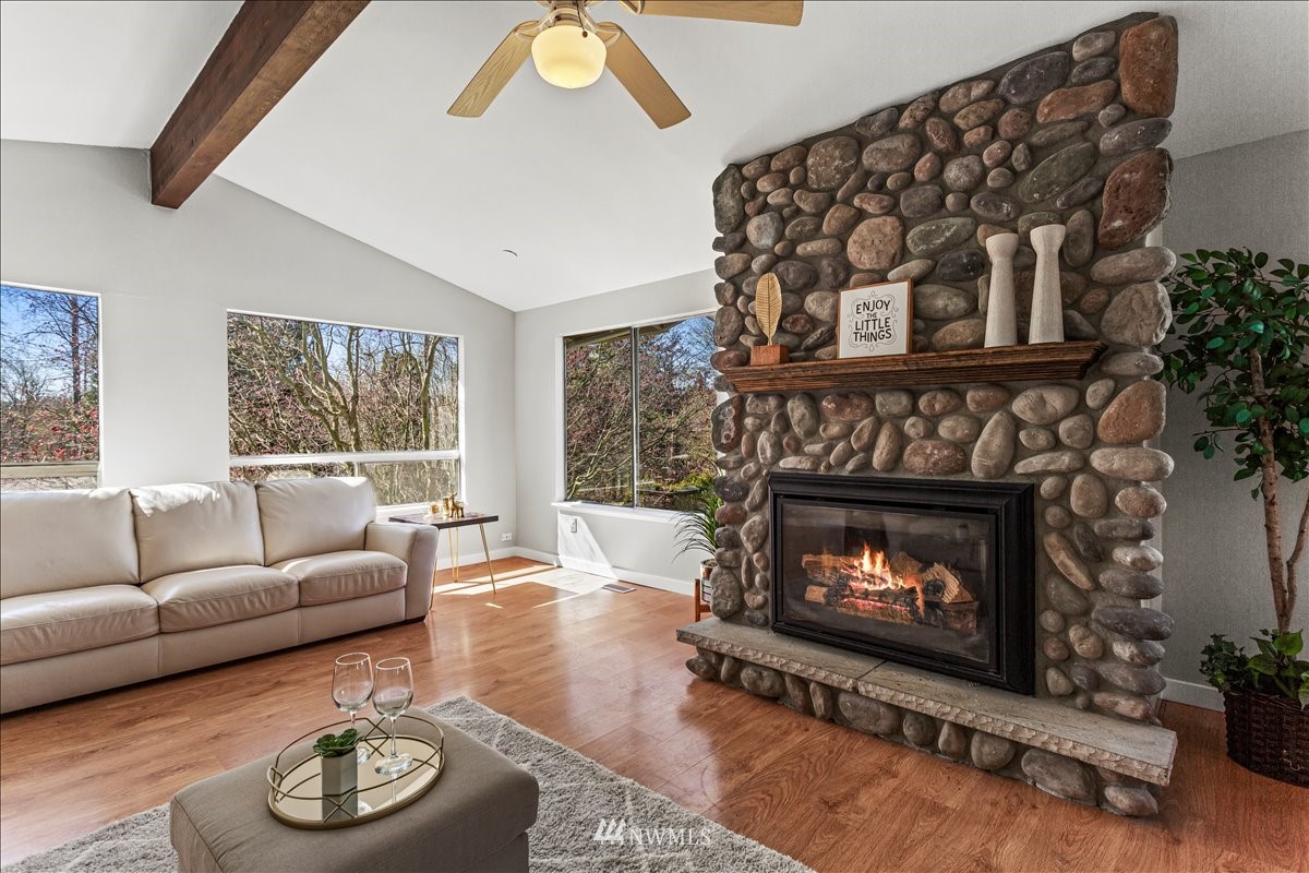 17320 Southeast 135th Street Renton, WA 98059 - Photo 5 of 28 a living room with furniture and a fireplace