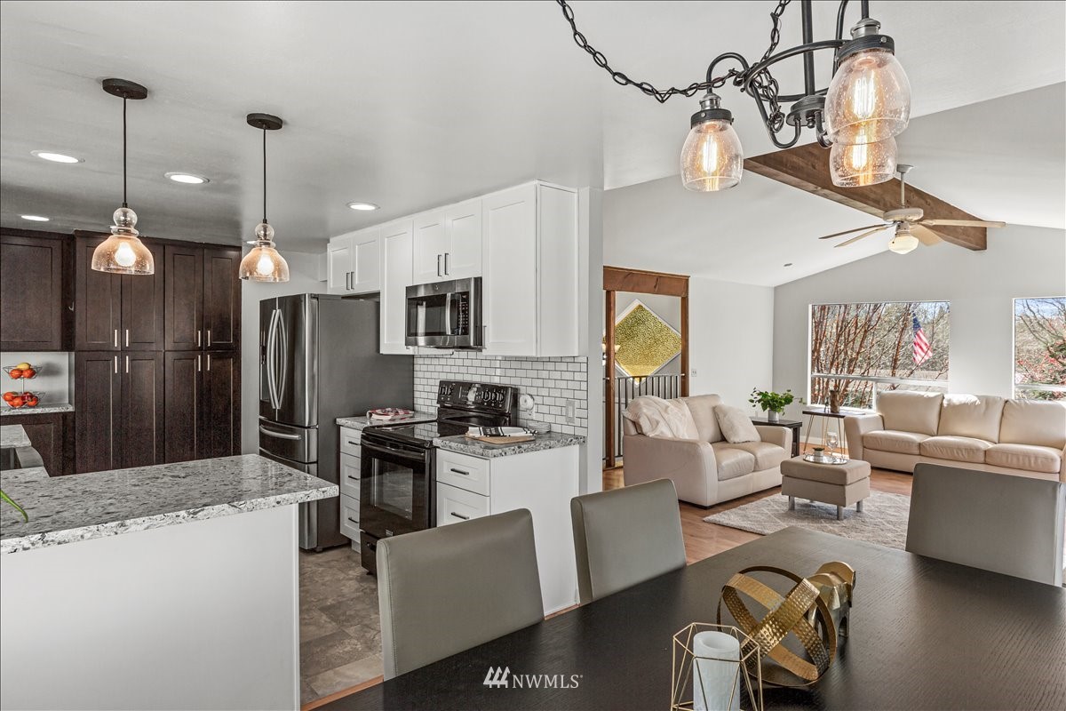 17320 Southeast 135th Street Renton, WA 98059 - Photo 9 of 28 a large kitchen with a table and chairs
