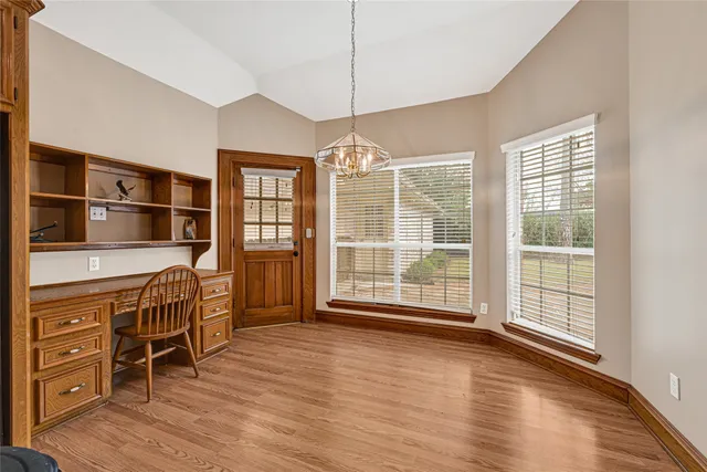a view of a livingroom with furniture window and wooden floor