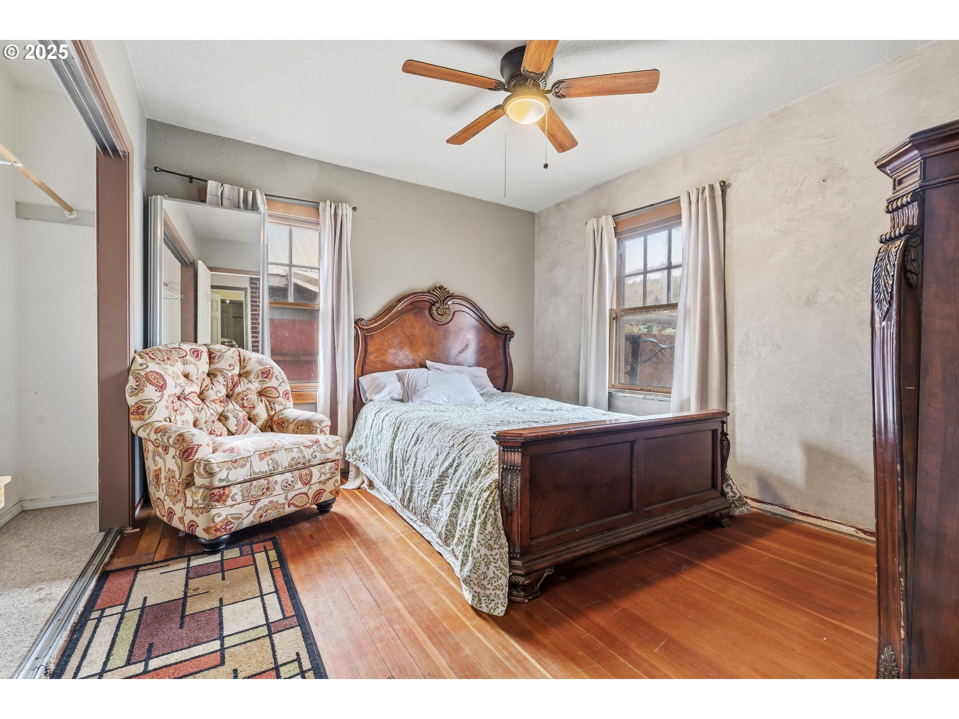 217 2nd Street Klickitat, WA 98628 - Photo 11 of 28 a bedroom with a bed wooden floor and window