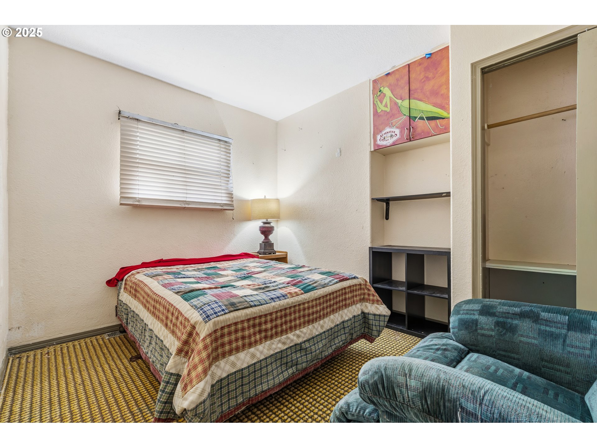 217 2nd Street Klickitat, WA 98628 - Photo 12 of 28 a bedroom with bed and a couch