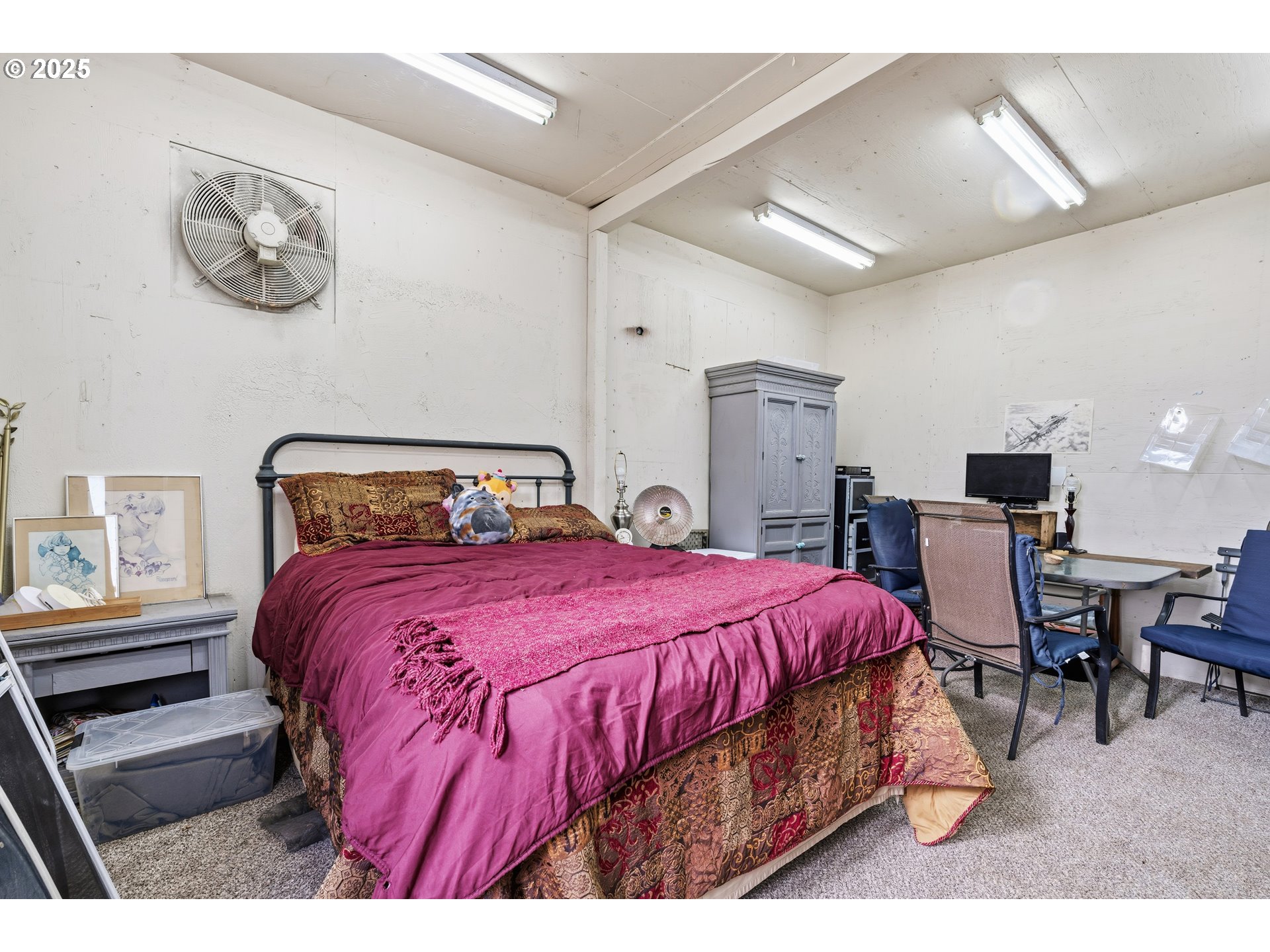 217 2nd Street Klickitat, WA 98628 - Photo 17 of 28 a bedroom with a bed and a table with chair