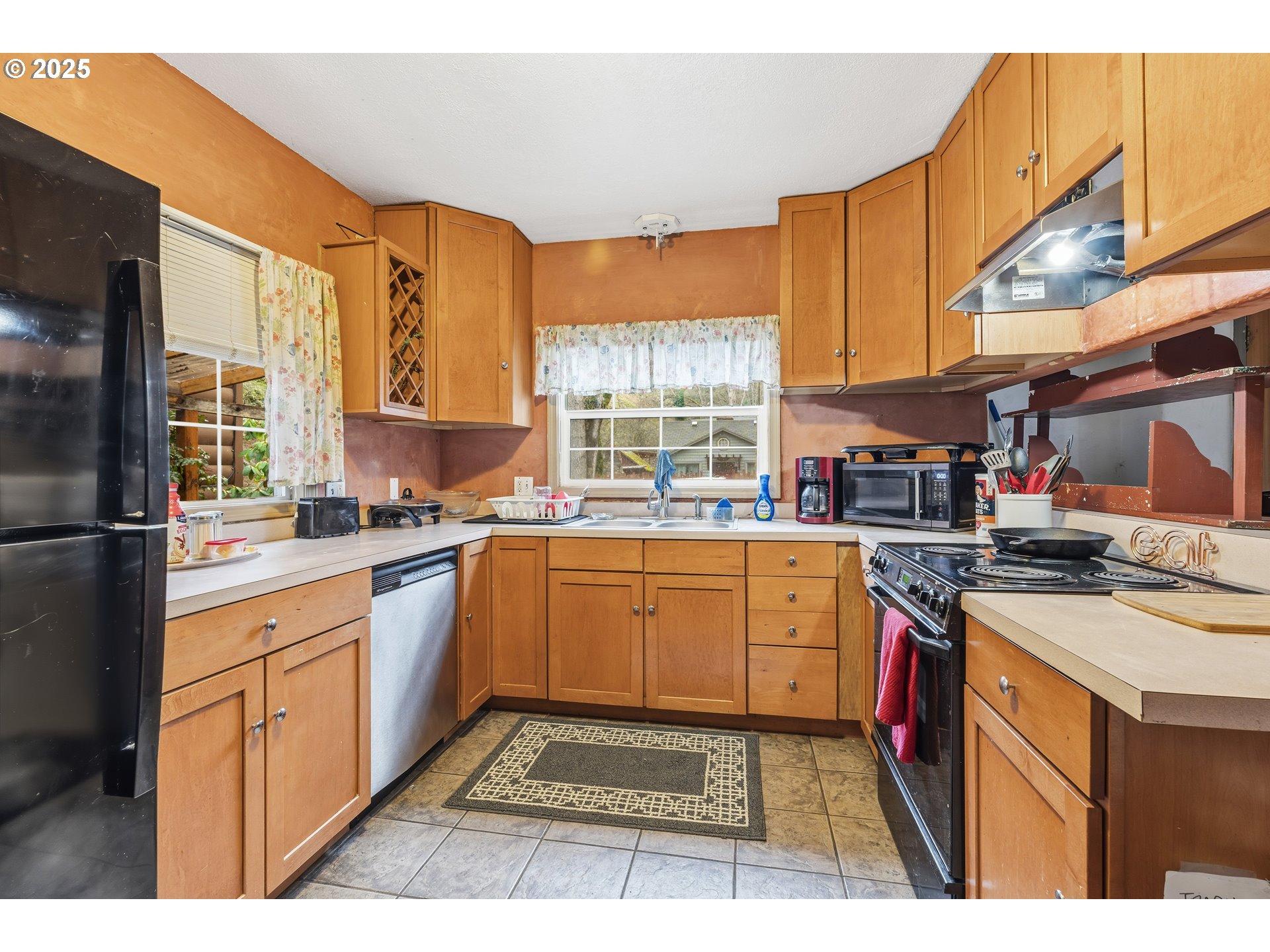 217 2nd Street Klickitat, WA 98628 - Photo 8 of 28 a kitchen with stainless steel appliances granite countertop a stove a sink and a microwave