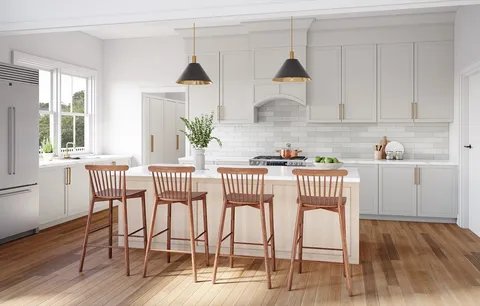 a kitchen with stainless steel appliances a dining table chairs and wooden floor