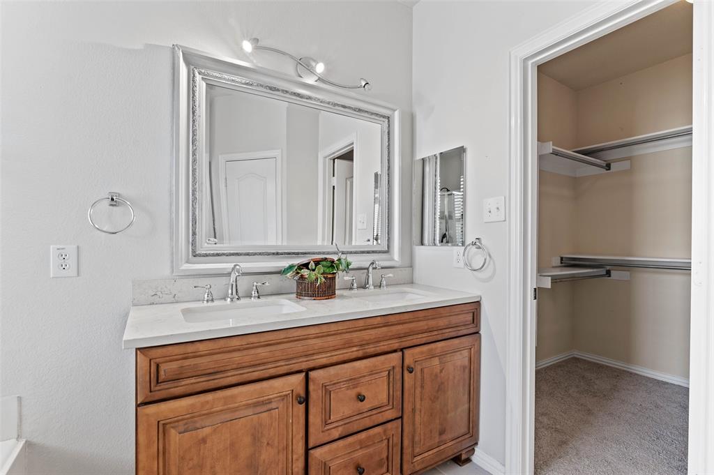2617 Hollow Ridge Drive Denton, TX 76210 - Photo 14 of 32 a bathroom with a double vanity sink mirror and double