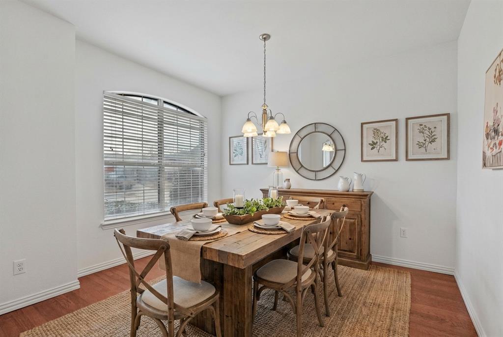 2617 Hollow Ridge Drive Denton, TX 76210 - Photo 15 of 32 a view of a dining room with furniture window and wooden floor