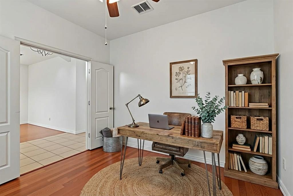 2617 Hollow Ridge Drive Denton, TX 76210 - Photo 18 of 32 a living room with furniture and a book shelf