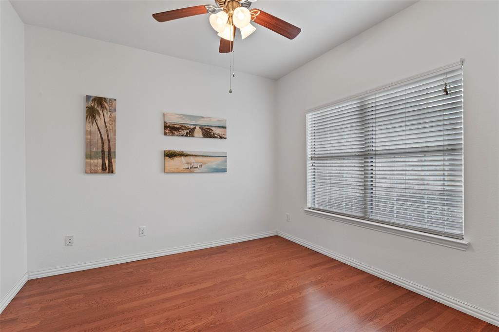 2617 Hollow Ridge Drive Denton, TX 76210 - Photo 20 of 32 a view of an empty room with a window and wooden floor
