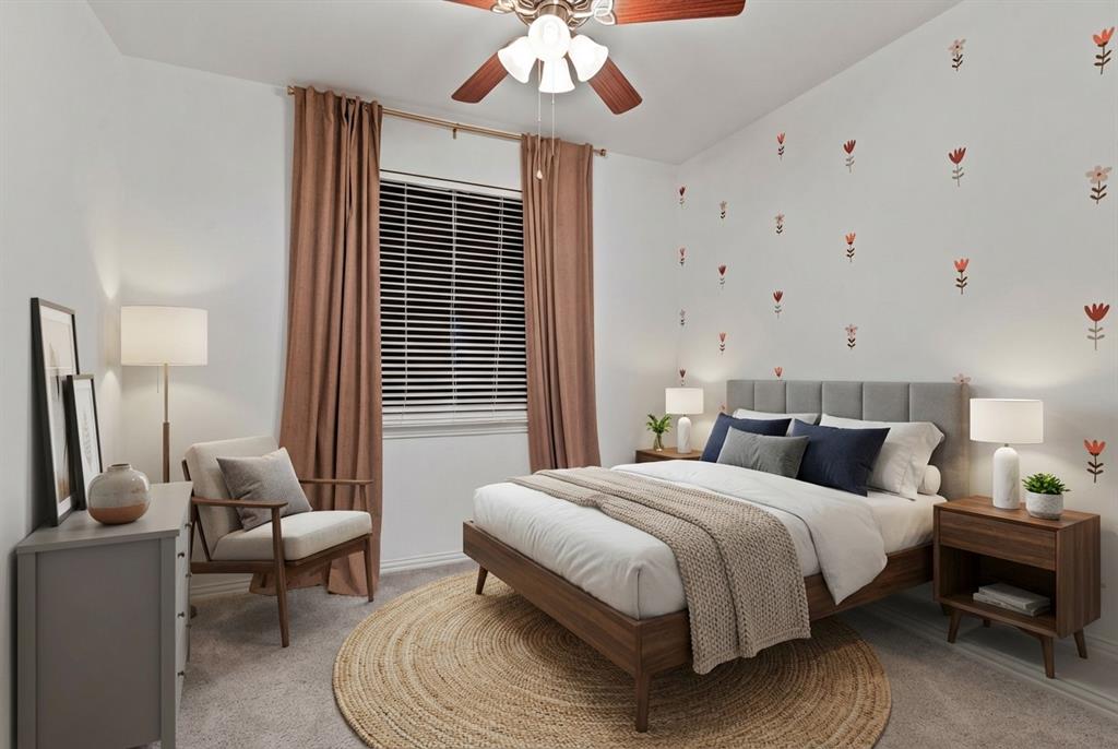 2617 Hollow Ridge Drive Denton, TX 76210 - Photo 23 of 32 a bedroom with a bed and a chandelier