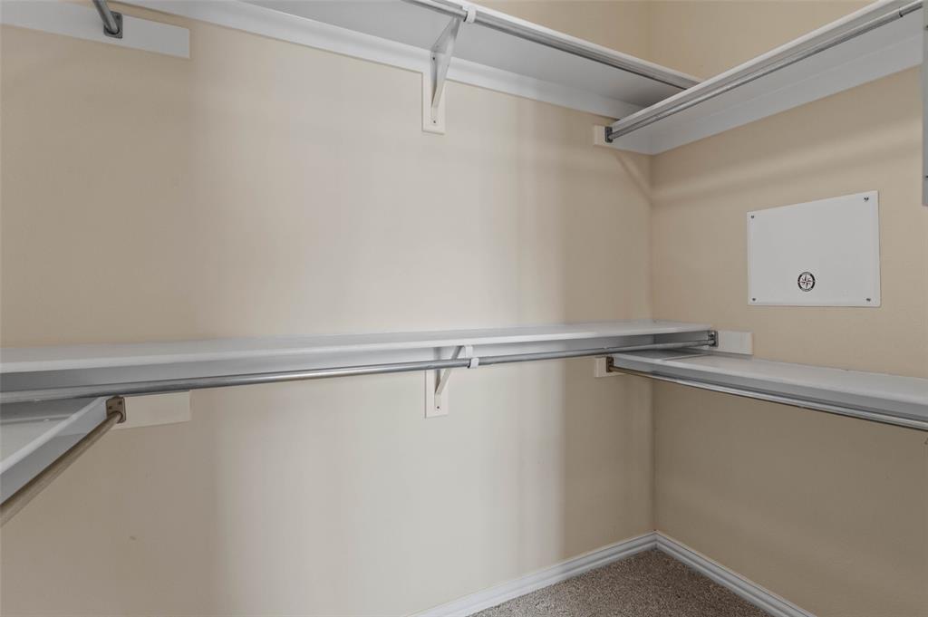 2617 Hollow Ridge Drive Denton, TX 76210 - Photo 27 of 32 a view of a room with racks on the wall