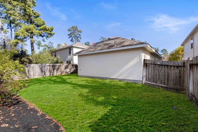 a backyard of a house with lots of green space