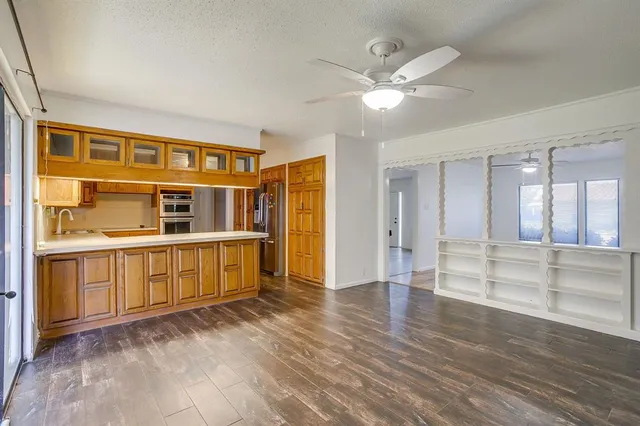 a view of an entryway with wooden floors