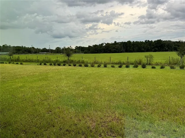 a view of a lake with houses in the back