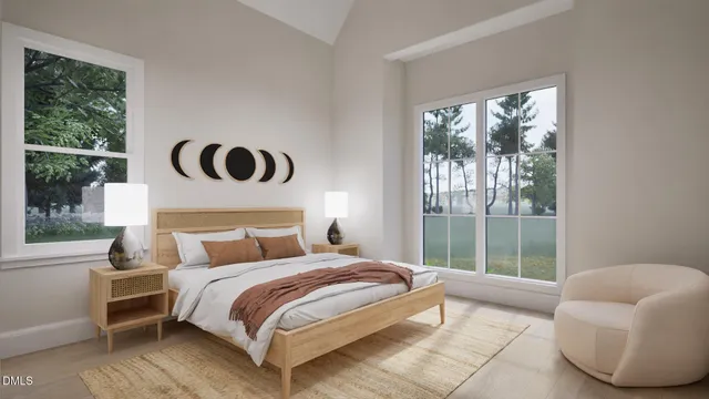 a bedroom with a bed and a large window