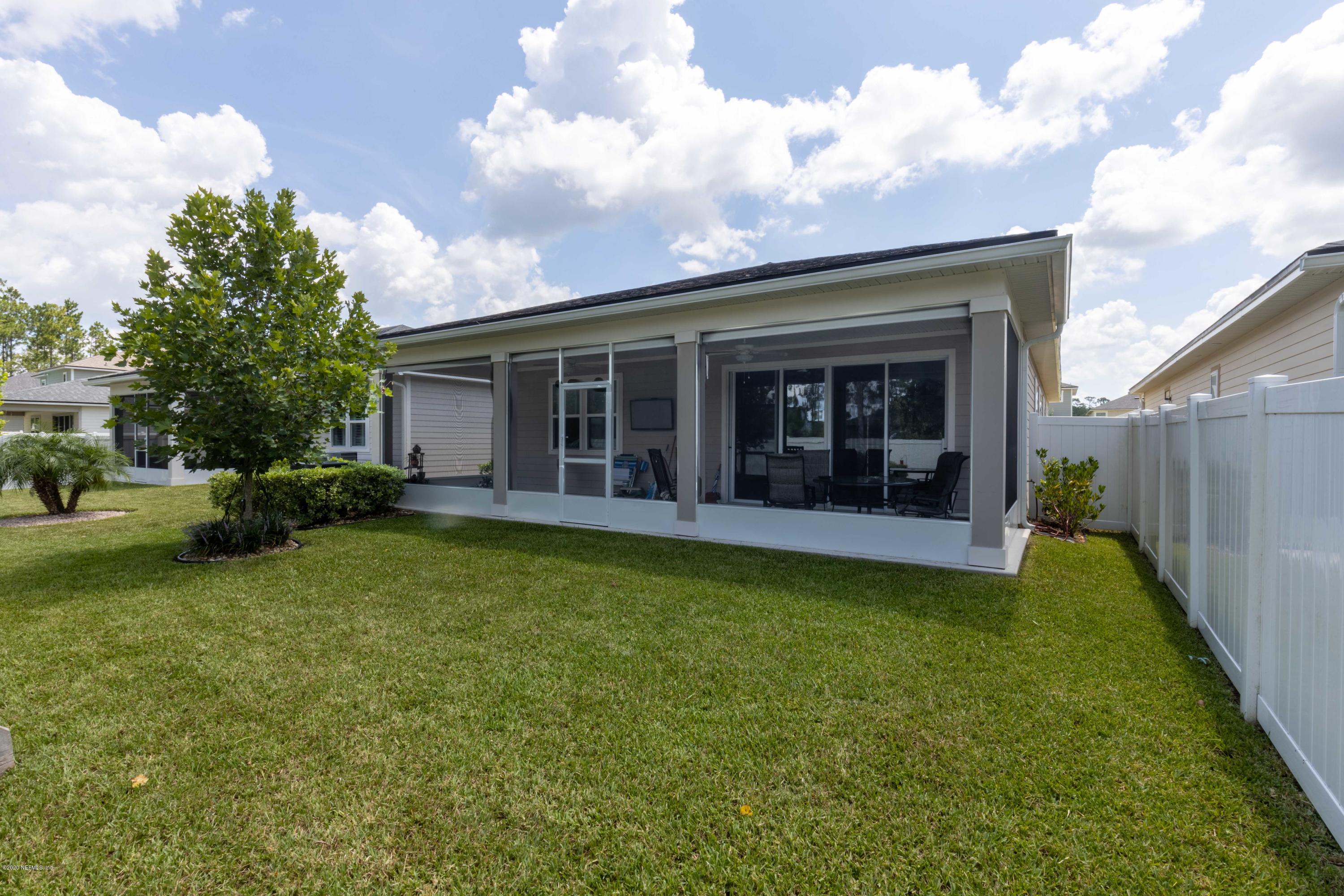 6642 Azalea Park Road Jacksonville, FL 32259 - Photo 11 of 42 a view of a house with backyard porch and garden
