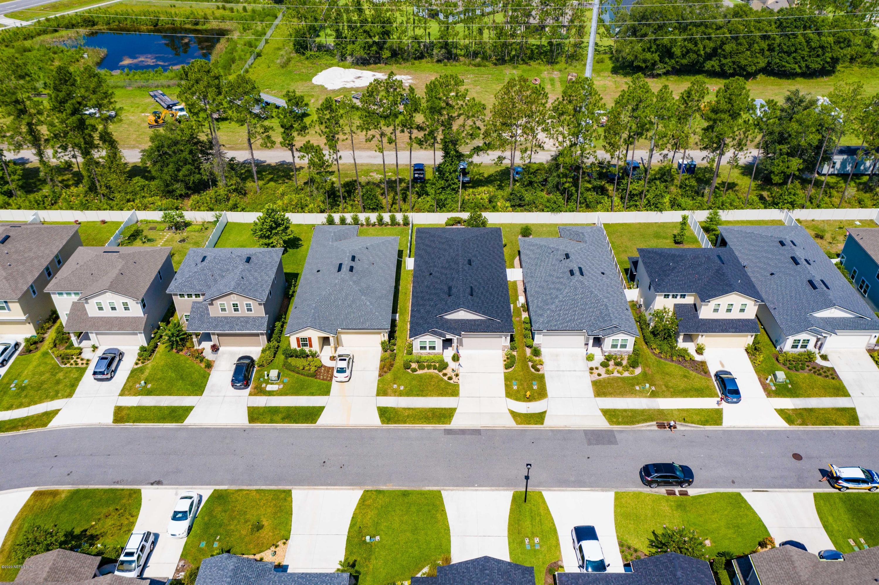 6642 Azalea Park Road Jacksonville, FL 32259 - Photo 12 of 42 an aerial view of residential houses with yard