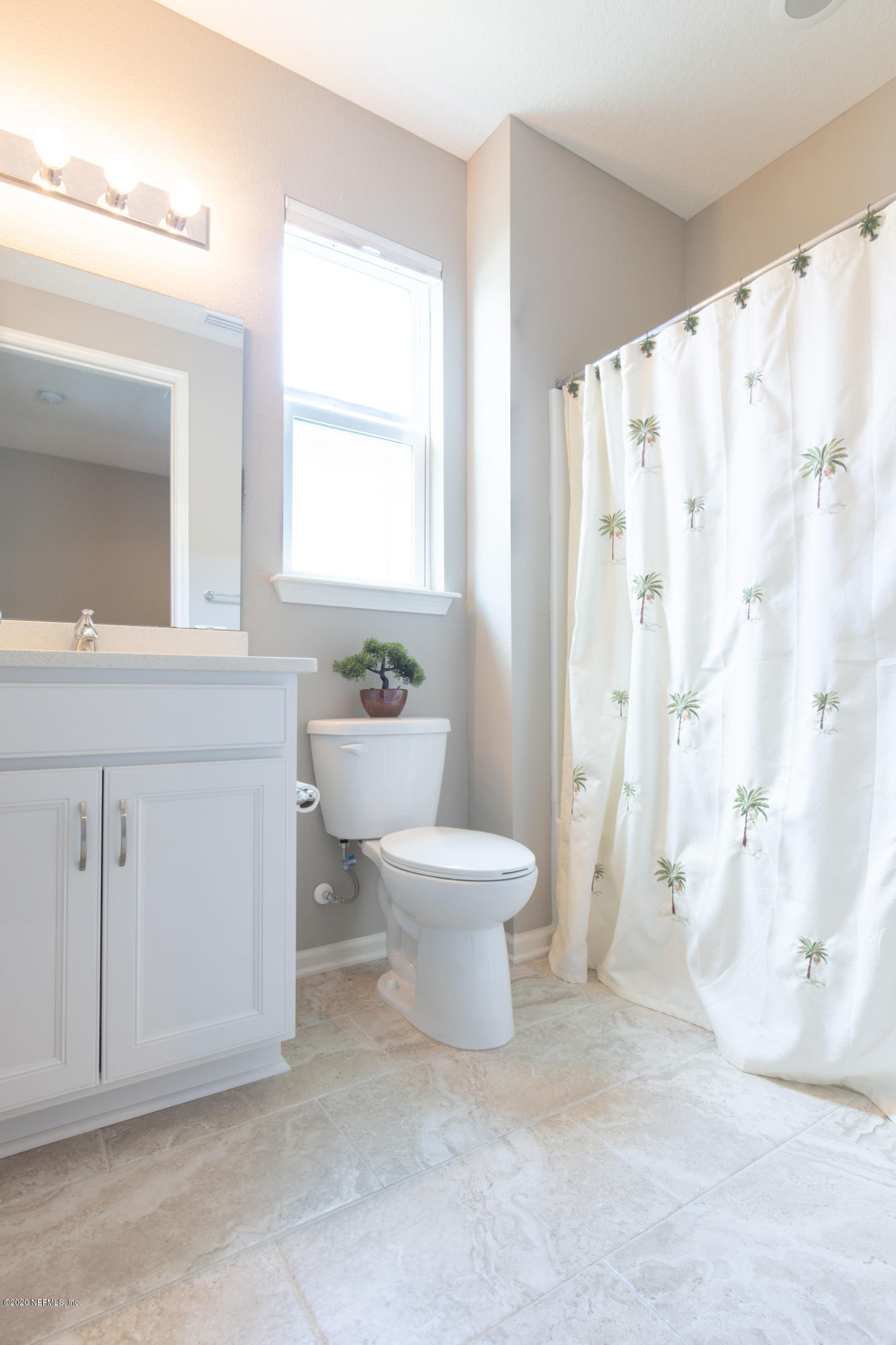 6642 Azalea Park Road Jacksonville, FL 32259 - Photo 13 of 42 a white toilet sitting next to a bathroom sink