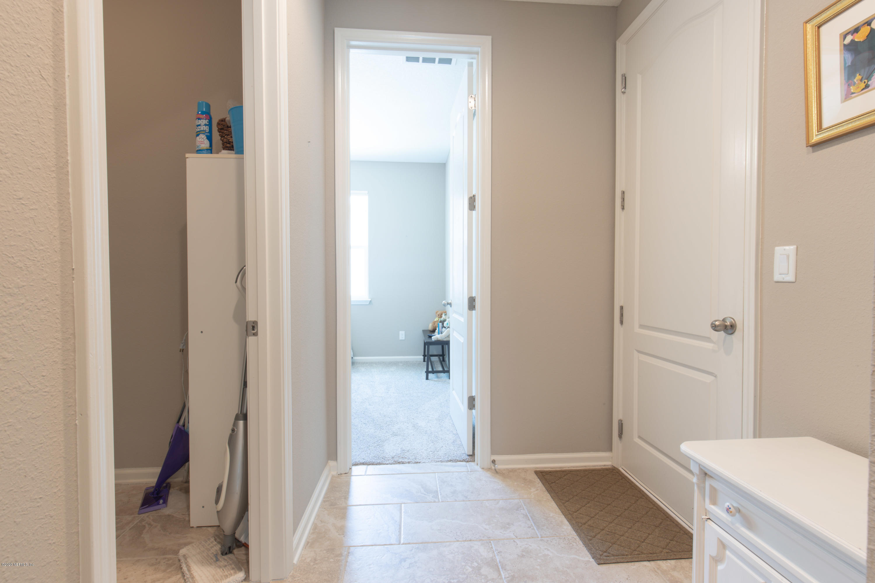 6642 Azalea Park Road Jacksonville, FL 32259 - Photo 15 of 42 a view of a hallway with bathroom and a bathroom
