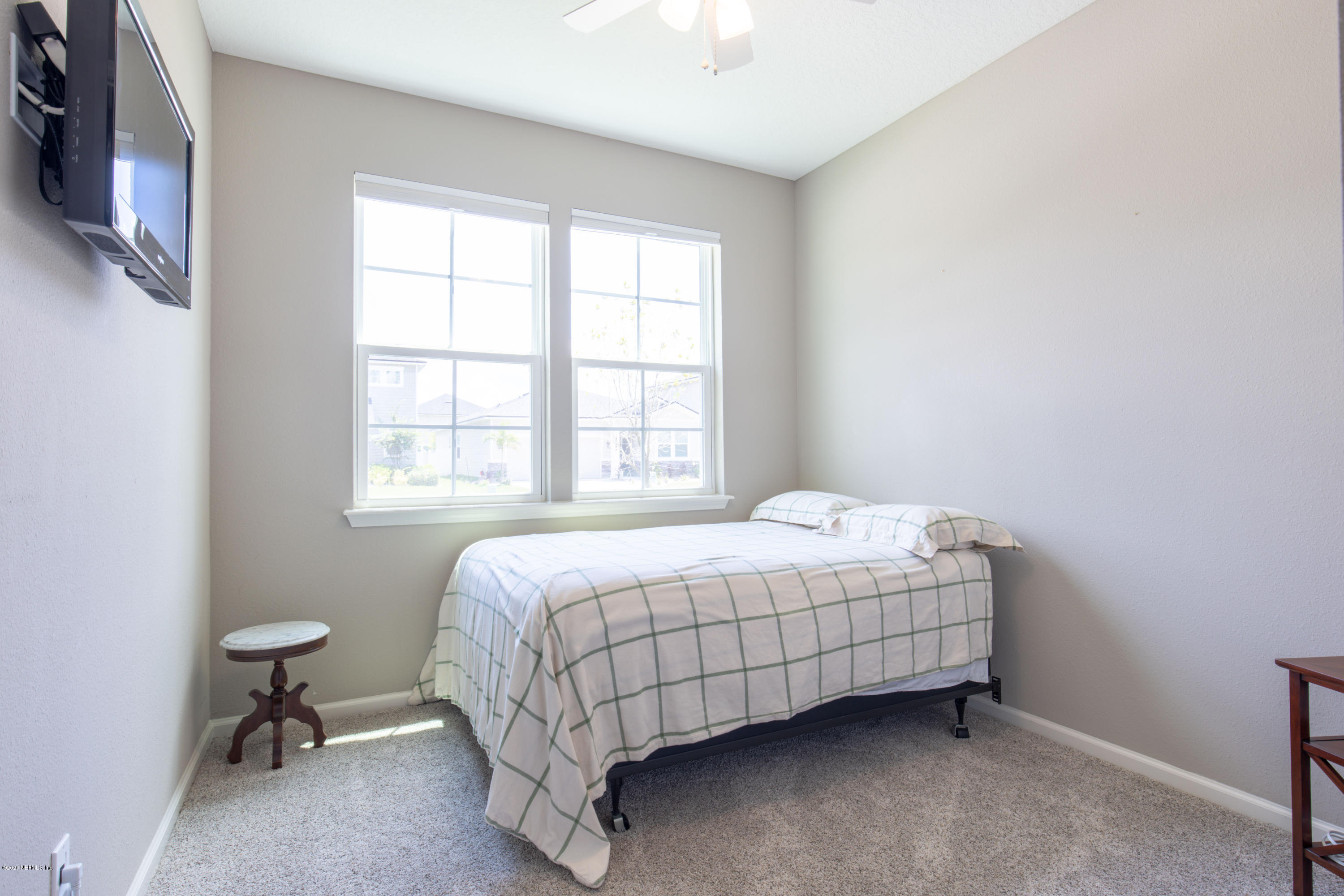 6642 Azalea Park Road Jacksonville, FL 32259 - Photo 16 of 42 a bedroom with a bed and a window