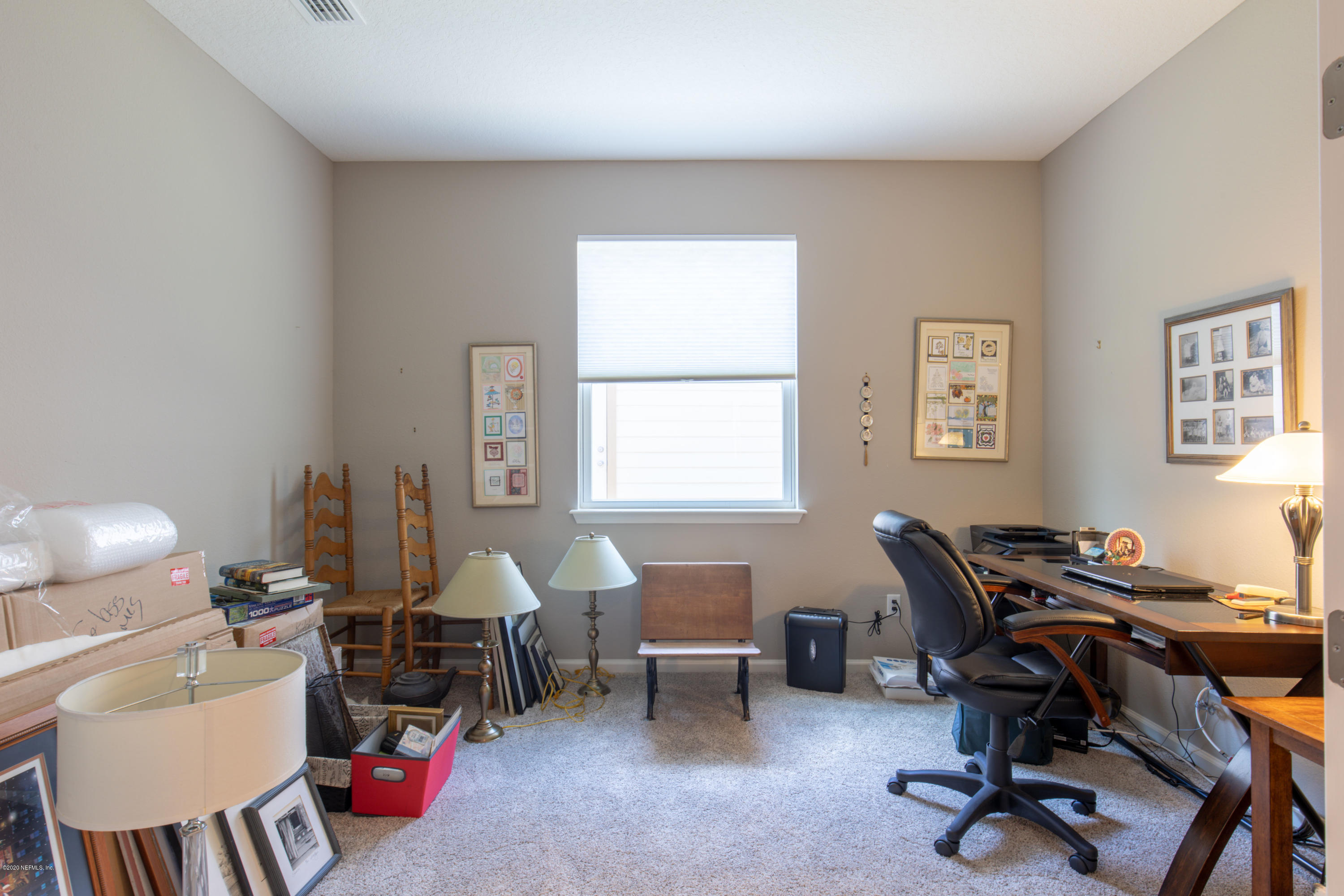 6642 Azalea Park Road Jacksonville, FL 32259 - Photo 19 of 42 a view of a workspace with furniture and a window