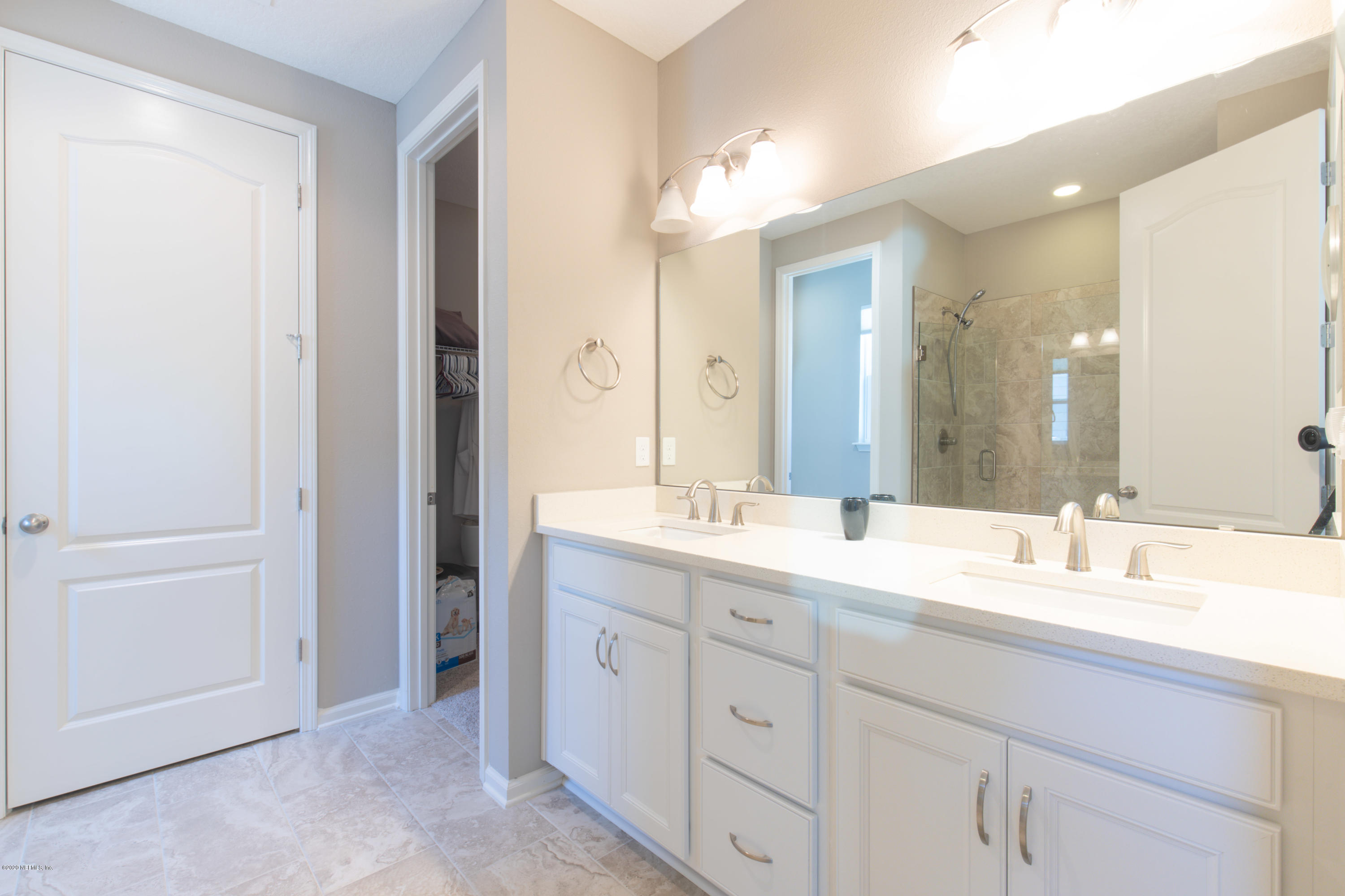 6642 Azalea Park Road Jacksonville, FL 32259 - Photo 23 of 42 a bathroom with a double vanity sink mirror and double