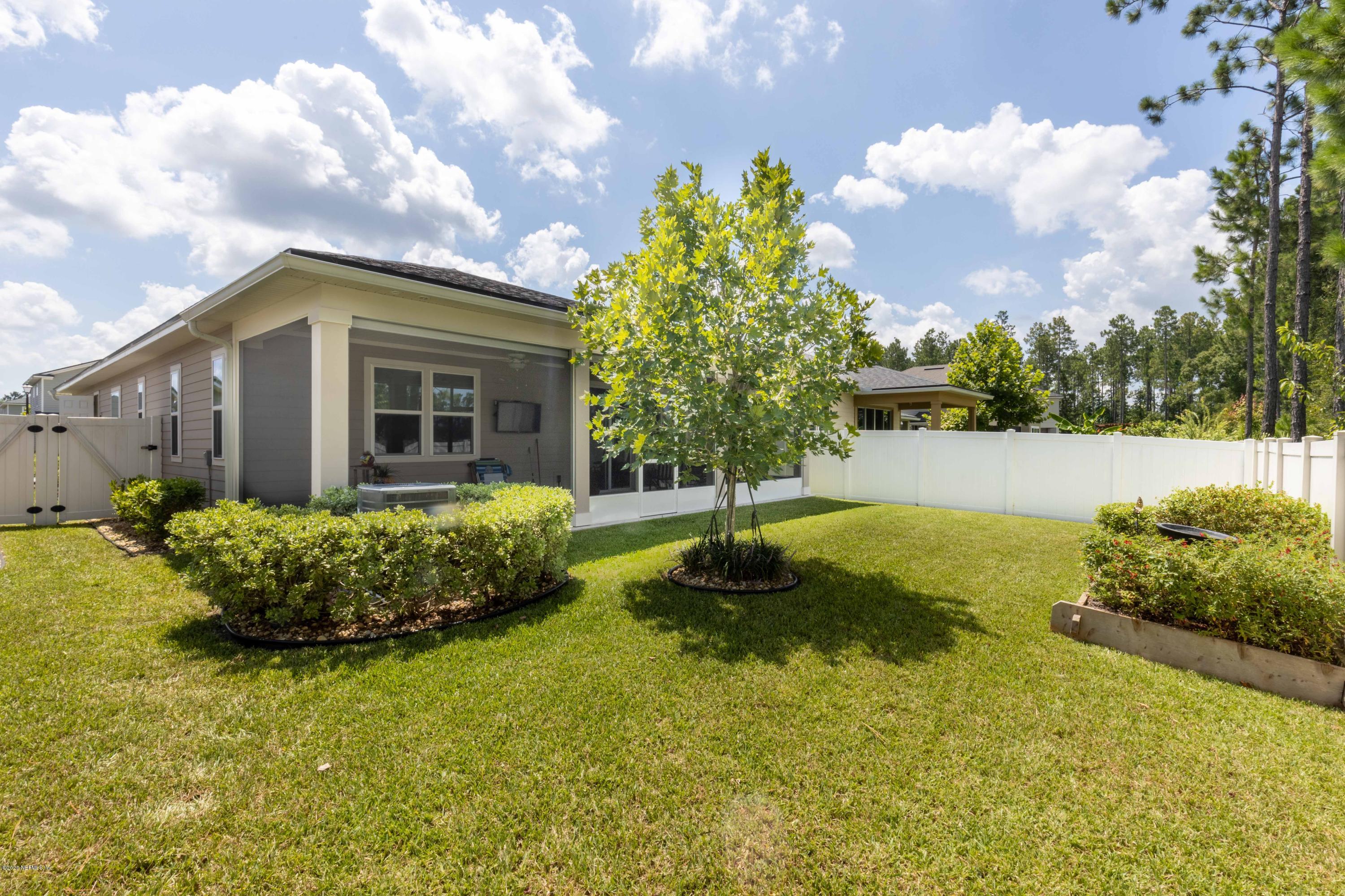 6642 Azalea Park Road Jacksonville, FL 32259 - Photo 30 of 42 a view of a garden with a fountain