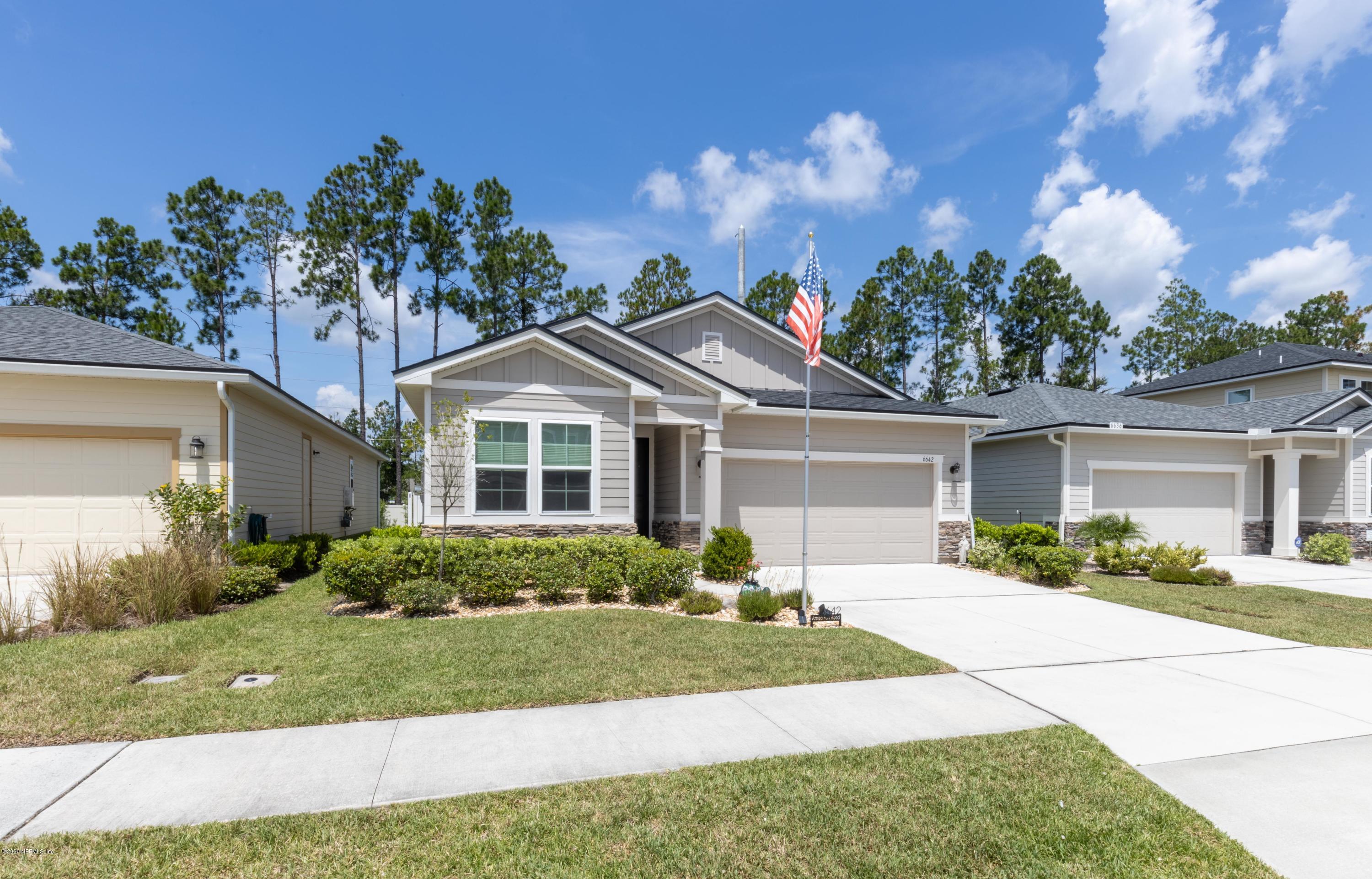 6642 Azalea Park Road Jacksonville, FL 32259 - Photo 34 of 42 front view of a house with a yard
