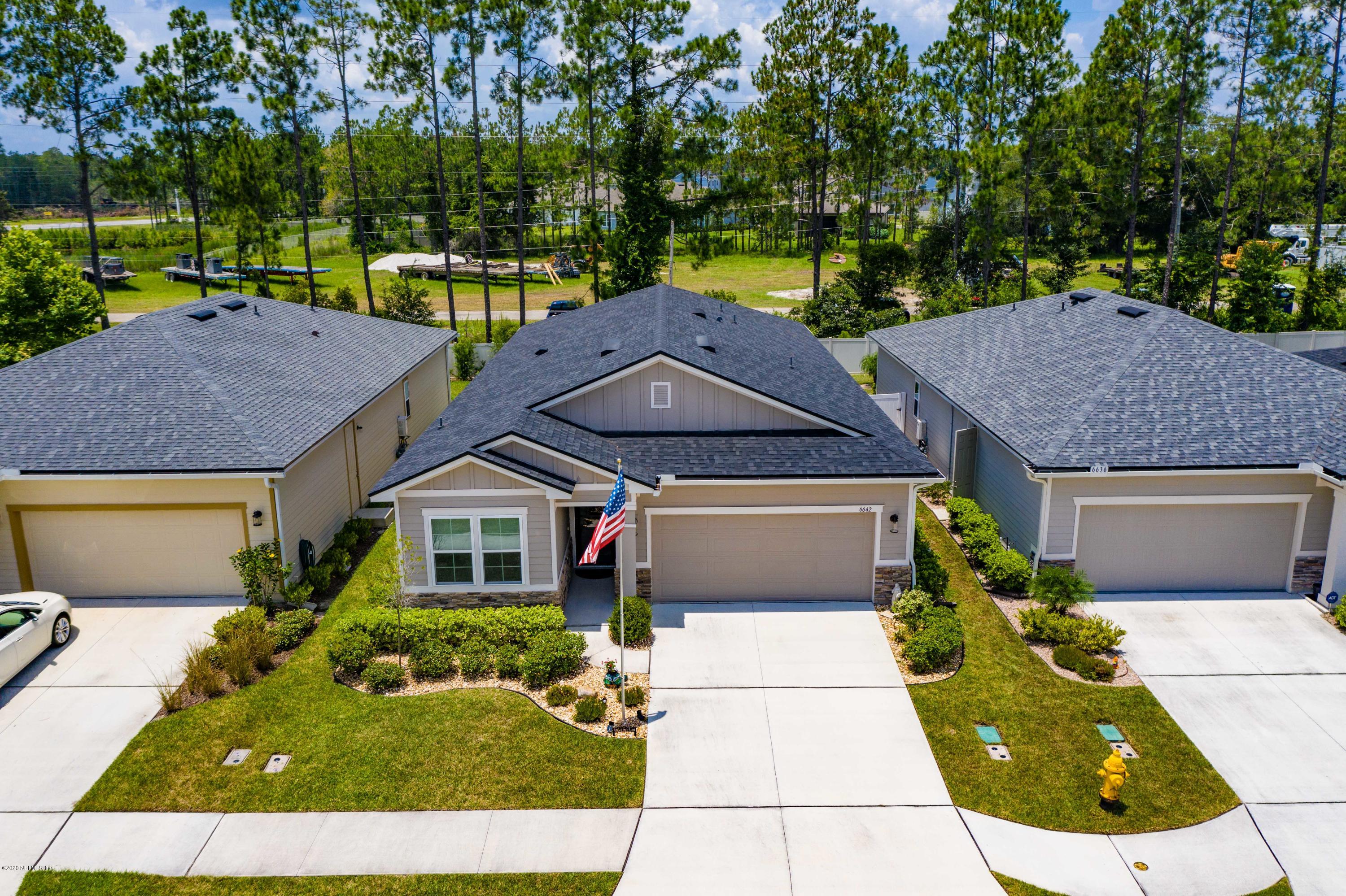 6642 Azalea Park Road Jacksonville, FL 32259 - Photo 35 of 42 a house with garden in front of it
