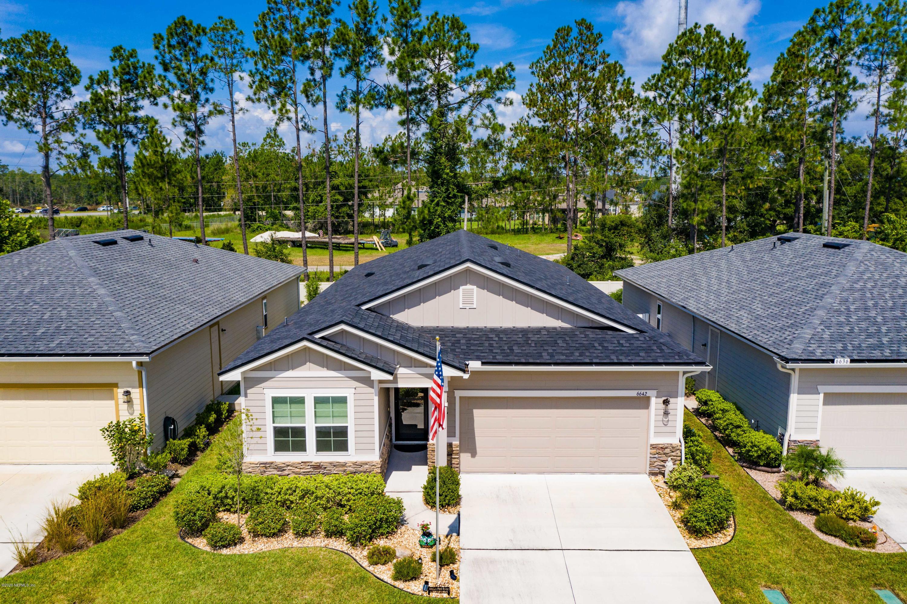 6642 Azalea Park Road Jacksonville, FL 32259 - Photo 38 of 42 a front view of a house with a yard