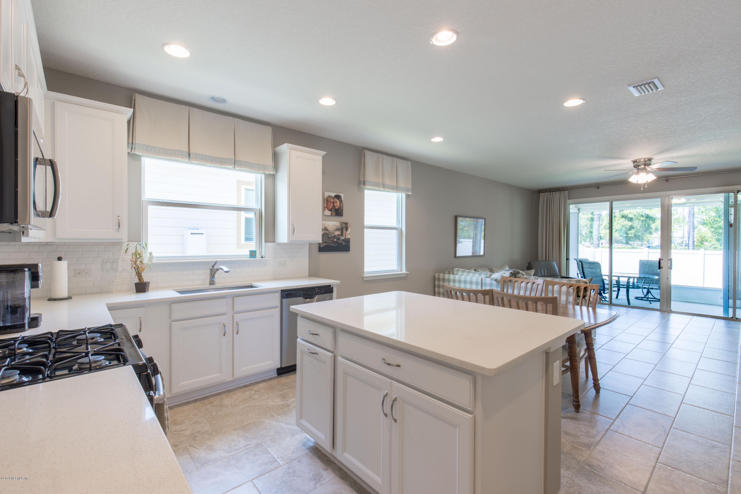 6642 Azalea Park Road Jacksonville, FL 32259 - Photo 5 of 42 a large white kitchen with a large window