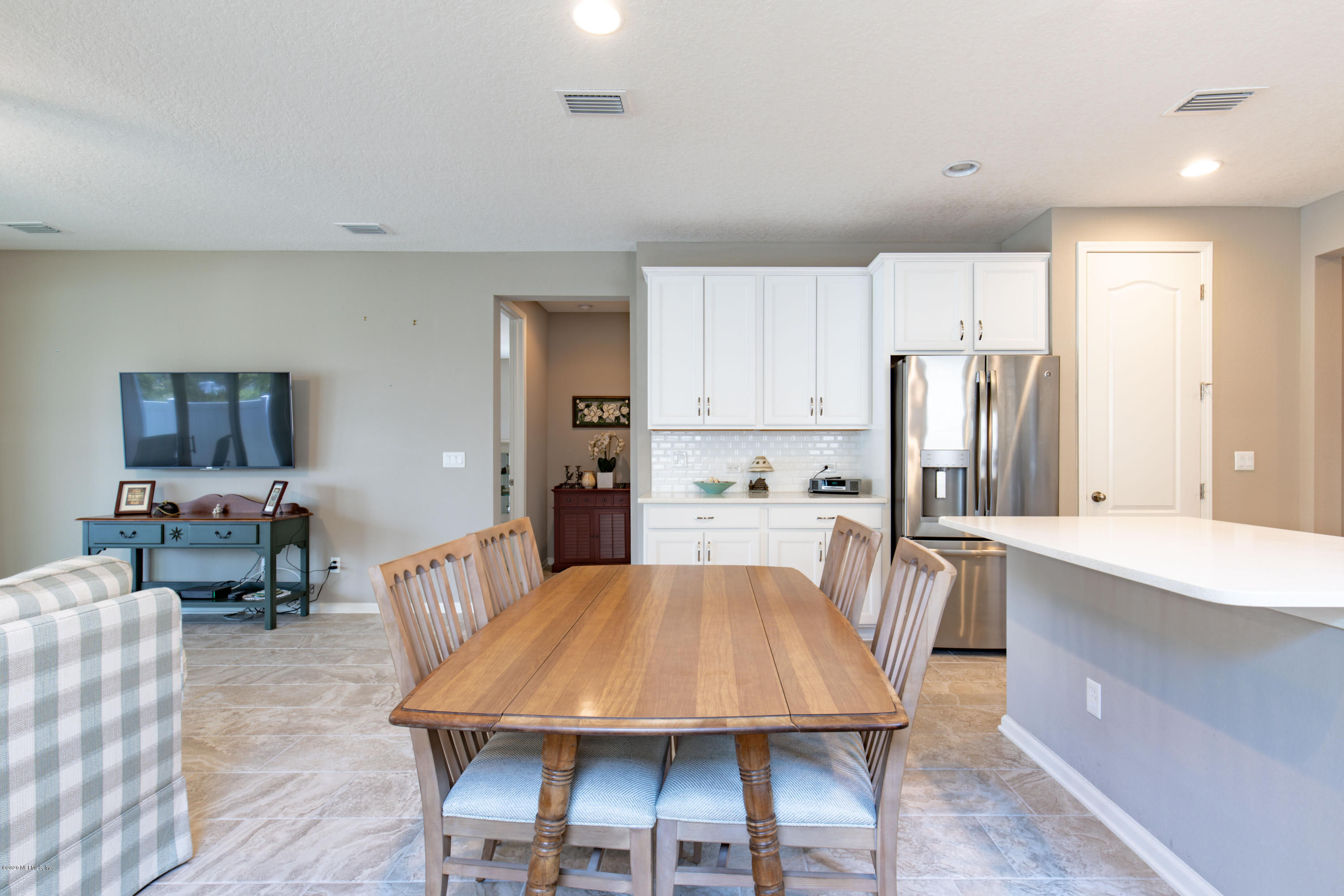 6642 Azalea Park Road Jacksonville, FL 32259 - Photo 7 of 42 a large kitchen with a table and chairs