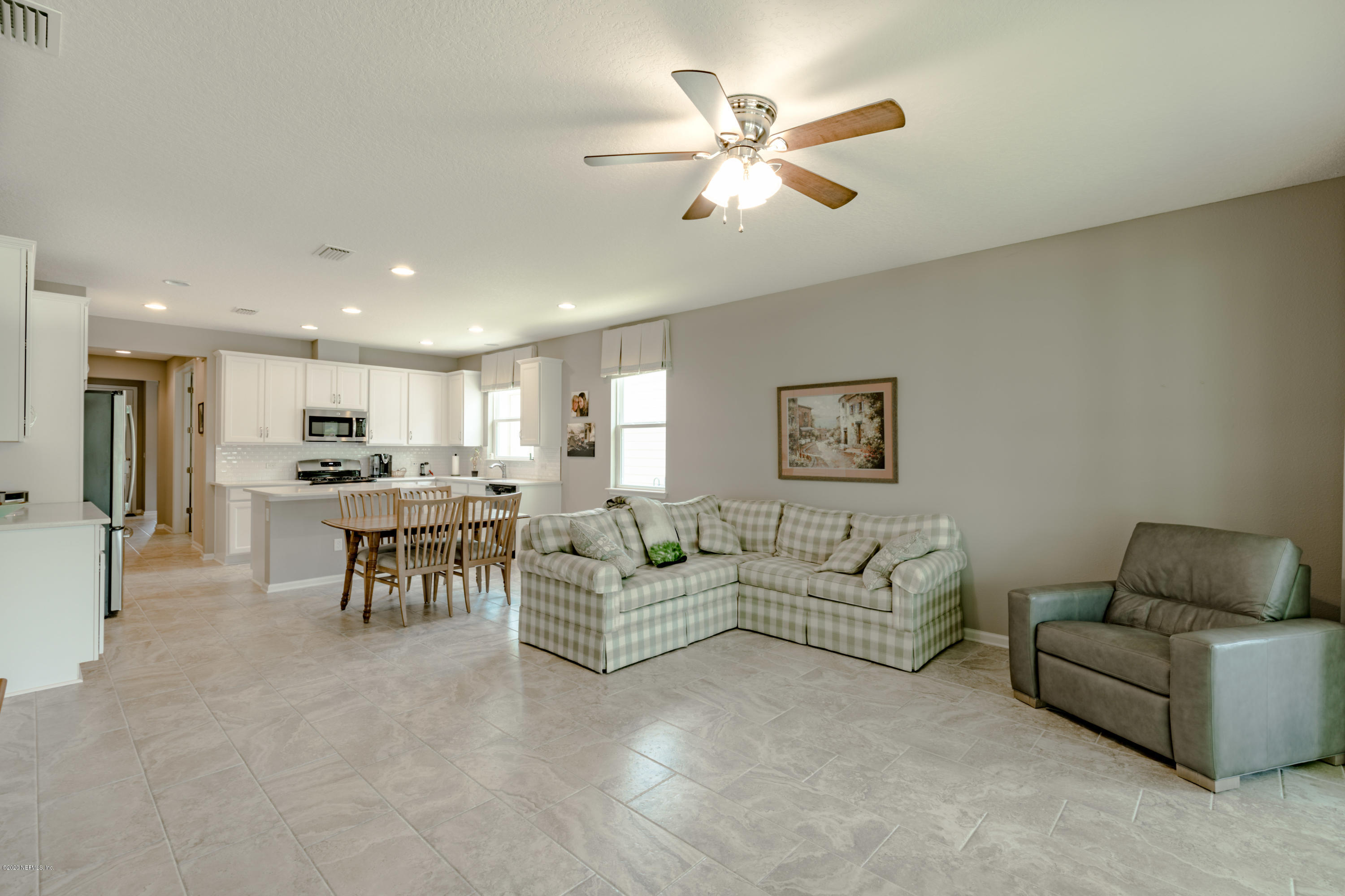 6642 Azalea Park Road Jacksonville, FL 32259 - Photo 9 of 42 a living room with furniture and a view of kitchen