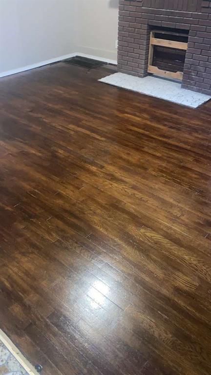 1408 Broadway Avenue McKees Rocks, PA 15136 - Photo 3 of 17 a view of an empty room with wooden floor and a window