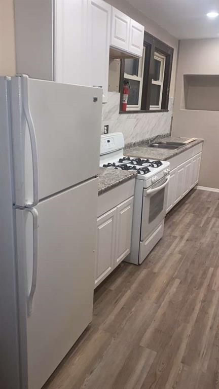 1408 Broadway Avenue McKees Rocks, PA 15136 - Photo 4 of 17 a white refrigerator freezer sitting inside of a kitchen