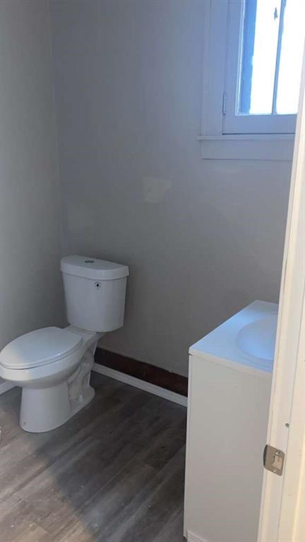 1408 Broadway Avenue McKees Rocks, PA 15136 - Photo 10 of 17 a white toilet sitting next to a window