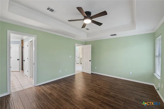 a bathroom with a bathtub sink and mirror