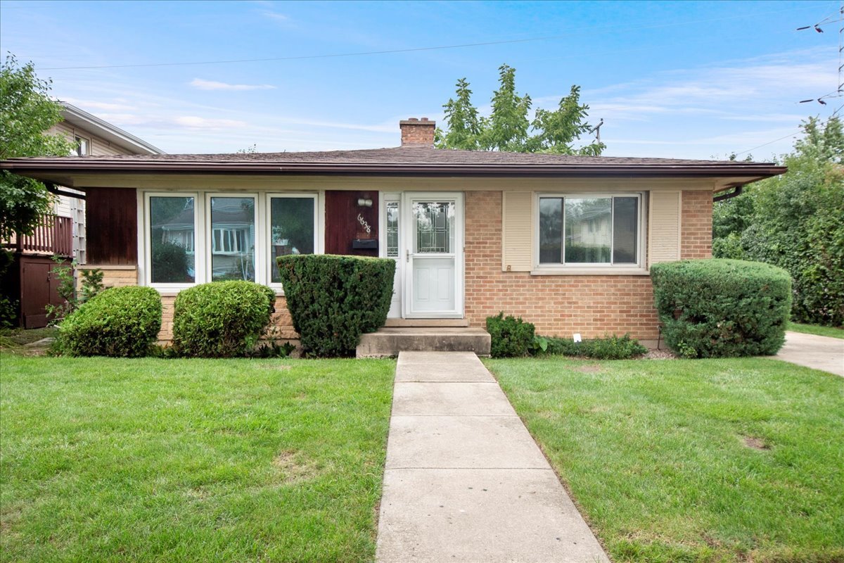 6638 Hazel Street Morton Grove, IL 60053 - Photo 1 of 19 front view of a house with a yard