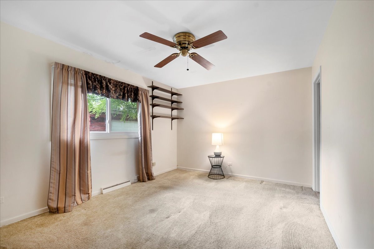 6638 Hazel Street Morton Grove, IL 60053 - Photo 11 of 19 a view of empty room with ceiling fan
