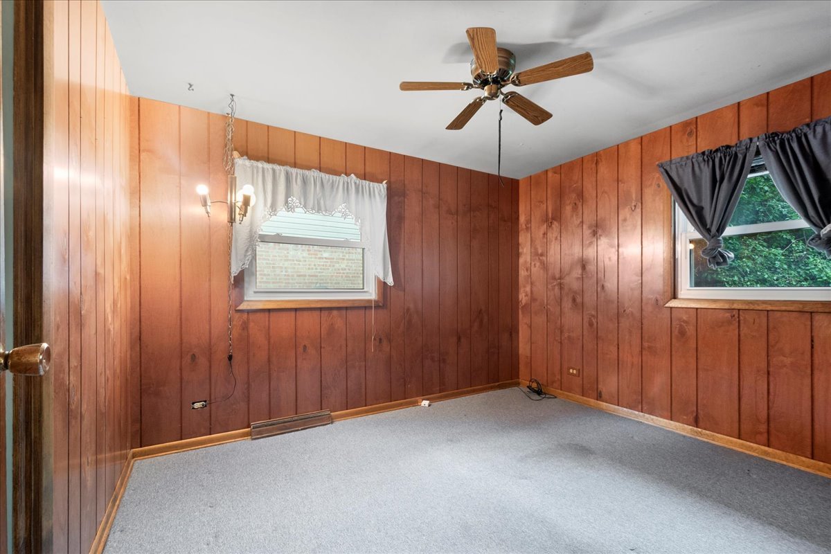 6638 Hazel Street Morton Grove, IL 60053 - Photo 13 of 19 an empty room with ceiling fan and windows
