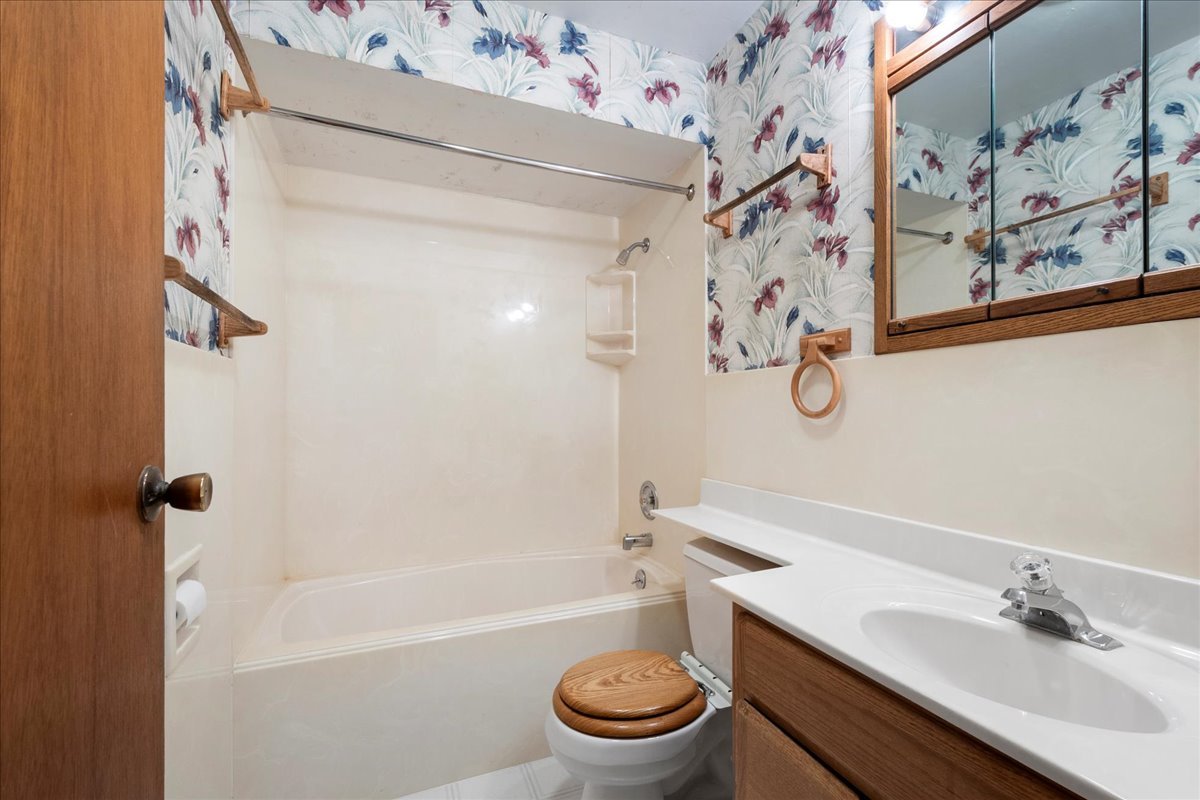 6638 Hazel Street Morton Grove, IL 60053 - Photo 14 of 19 a bathroom with a sink toilet and shower