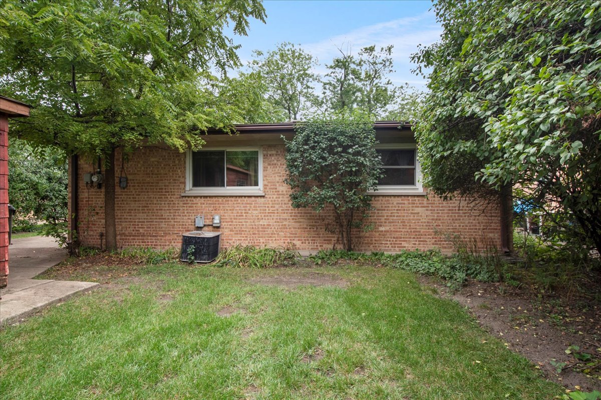 6638 Hazel Street Morton Grove, IL 60053 - Photo 16 of 19 a view of house with backyard space and garden