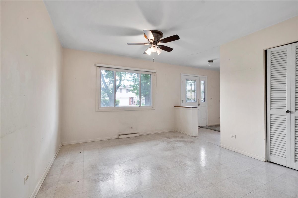6638 Hazel Street Morton Grove, IL 60053 - Photo 6 of 19 a view of an empty room with a window