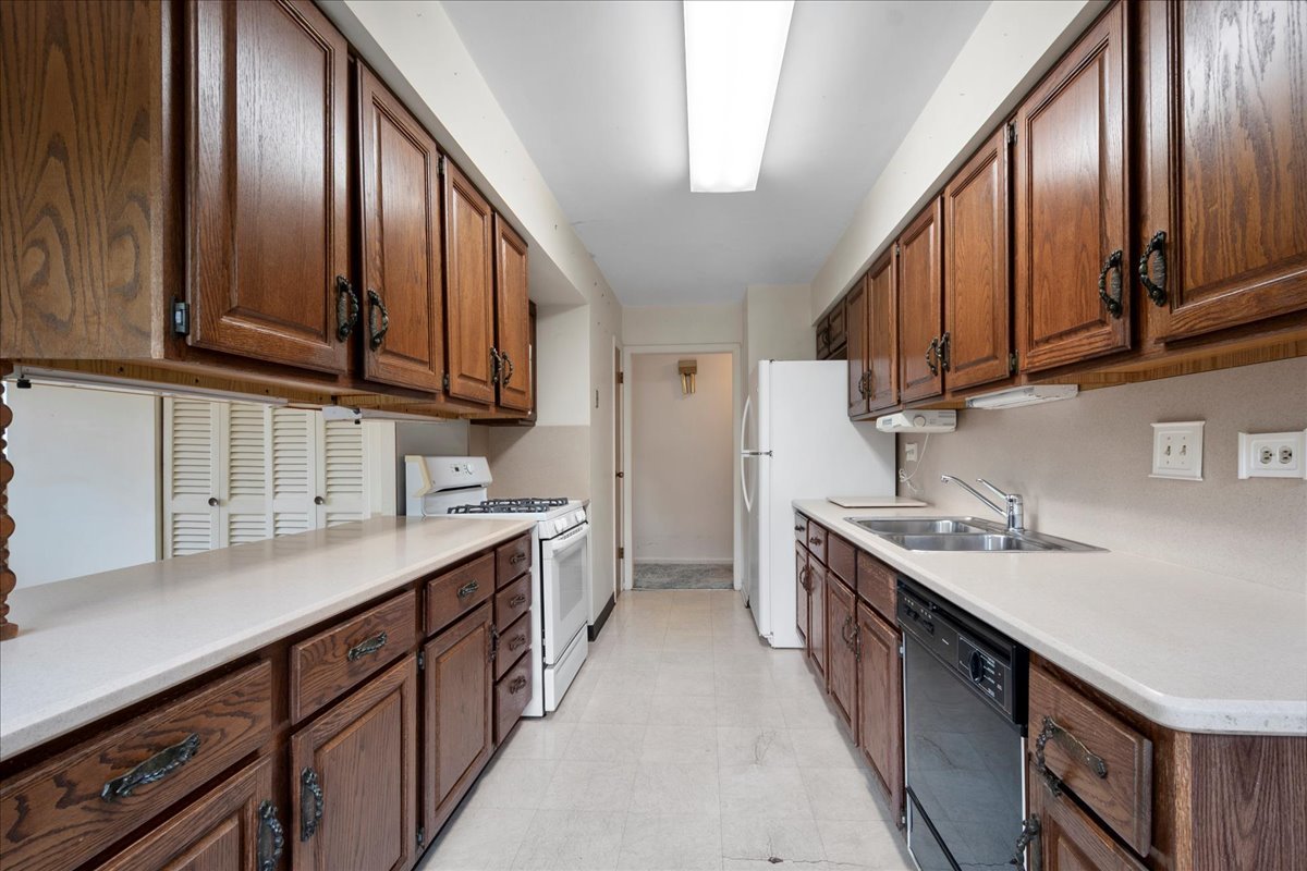 6638 Hazel Street Morton Grove, IL 60053 - Photo 9 of 19 a kitchen with a sink stove and cabinets