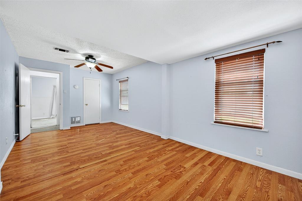 606 South Gordon Street Sherman, TX 75092 - Photo 17 of 22 a bedroom with a bed and a window