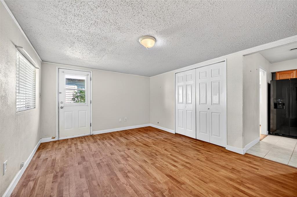 606 South Gordon Street Sherman, TX 75092 - Photo 10 of 22 wooden floor in an empty room with a window