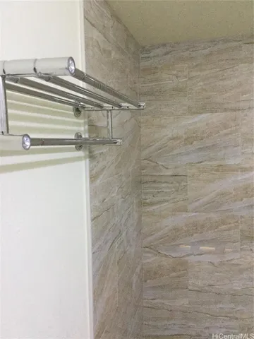 a bathroom with a shower and a sink